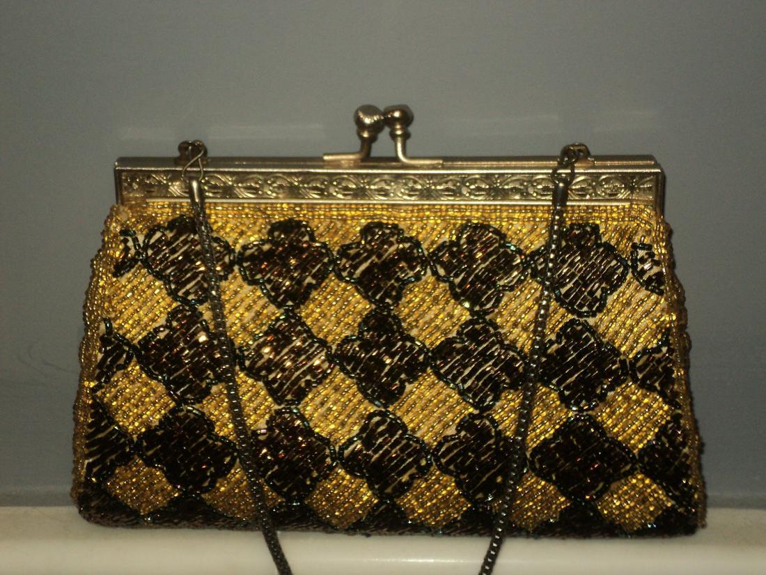 Vtg 1950/60s Beaded Bag gold bronze Satin lined: Vintage from the 1950s Materials Satin, Beads, Metal more Description An amazing piece of Art.A vintage evening purse all exquisitely hand beaded in antique gold and bronze buggle beads in a stunning
