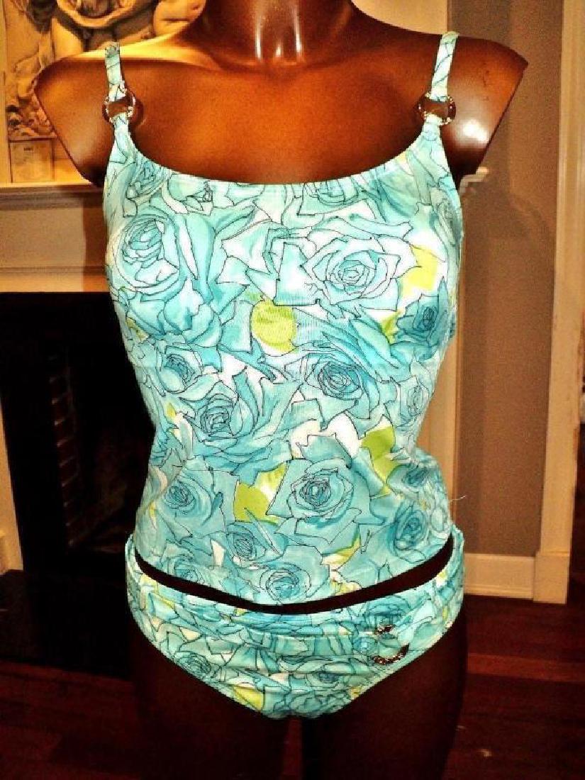 St John Aqua Tankini 2pc swimsuit showroom piece: Amazing 2pc St. John Tankini aqua swimsuit with gold metal hardware Iconic signature The suit was not used it is a showroom piece Size-4 Very Collectible Reserve: $40.00 Shipping: Domestic: Flat-rate 