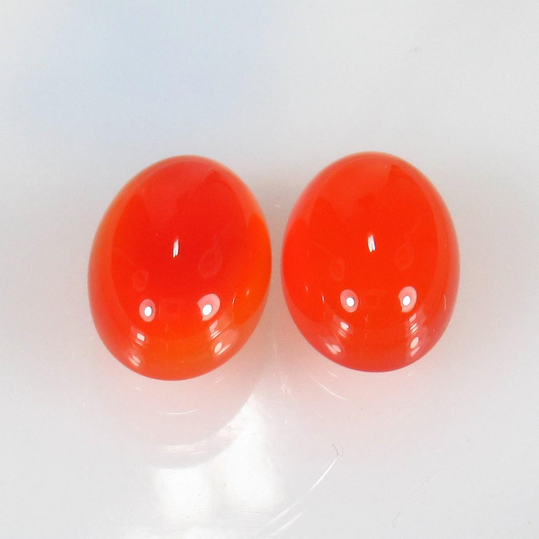 12.64 Ct Natural Orange Carnelian Oval Pair: Title: 12.64 Ct Natural Orange Carnelian Oval Pair Stone Clarity: Semi-Transparent Gemstones: Natural Carnelian Carat Weights: 12.64 Size/Dimensions: 14.50 x 10.00 x 6.00 mm / 2 PC's Additional Inform