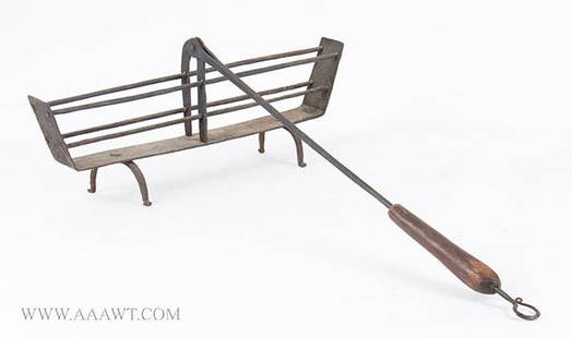 Wrought Iron Drop Handle Toaster, Arched Pad Feet, Wood: 424-196 Wrought Iron Drop Handle Toaster, Arched Pad Feet, Wood Handle Probably New England, Circa 1780-1820 (H: 7.5, L: 25”, W: 18”) Reserve: $150.00 Shipping:Domestic: Shipping rates are