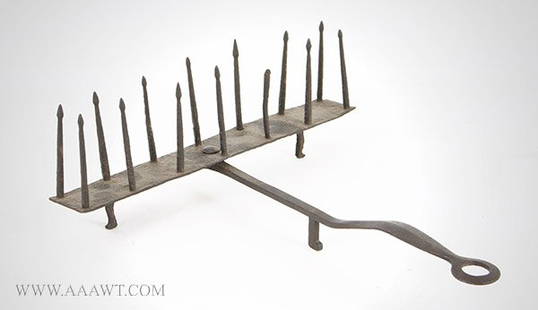 Wrought Iron Swivel Toaster, Fence Post Form, Ridged: 424-197 Wrought Iron Swivel Toaster, Fence Post Form, Ridged and Pierced Handle Unknown Maker, 18th Century (Maximum L: 21.5", maximum W: 13.75", H: 5.5") Reserve: $700.00 Shipping:Domestic: