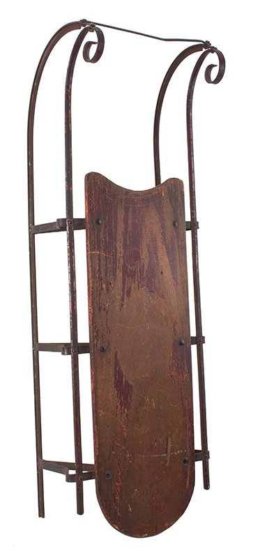 Victorian Child’s Snow Sled: 221153 Victorian Child’s Snow Sled American, 1890s The metal and wood retain traces of original red paint nd mustard color trim. (A single rivet has been replaced by nut and bolt. 36" x 12" x 10") R