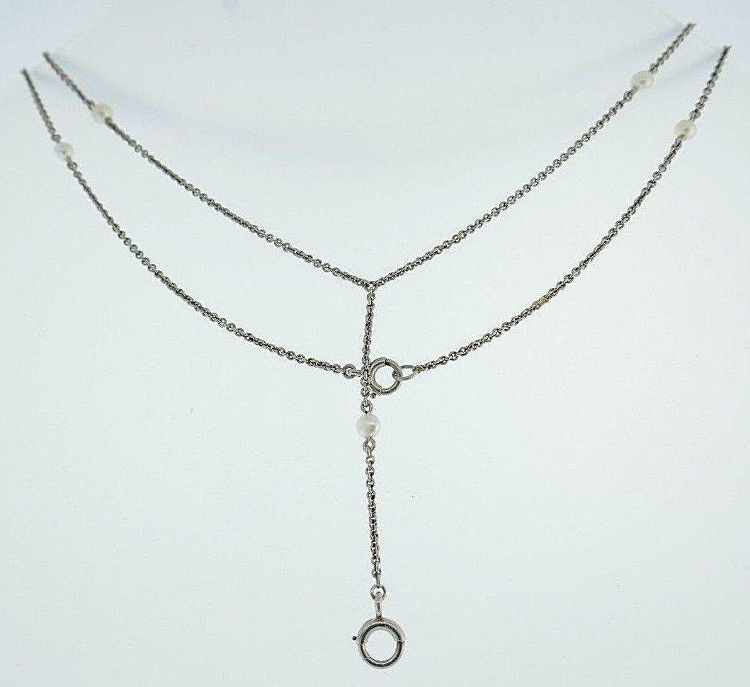 Vintage Platinum Natural Pearls Chain Necklace: NS R00 Vintage platinum chain necklace features natural pearls Has a hanging part in the middle (used to be a watch chain) to hang a pendant of your choice Measurements: 1/16" W x 23 1/2" L, the hangi