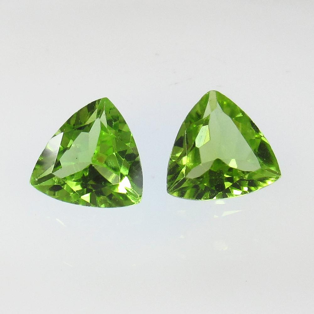 2.22 Ctw Natural Pakistan Peridot Trillion Pair: No Reserve! Title: 2.22 Ctw Natural Pakistan Peridot Trillion Pair Stone Clarity: VVS Gemstone: Peridot Carat Weight: 2.22 Size/Dimensions: 7.30 x 7.10 x 3.50 mm / 2 PC's Additional Information: Top C