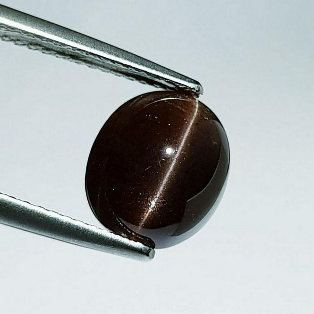 Natural Scapolite Cat's Eye 5.73 ct: No Reserve! Title: Natural Scapolite Cat's Eye 5.73 ct Color/Clarity: Opaque Gemstones: Loosegemstone Carat Weights: 5.73 Size/Dimensions: 10.00 x 8.80 x 8.20 Additional Information: Oval - Srilanka S