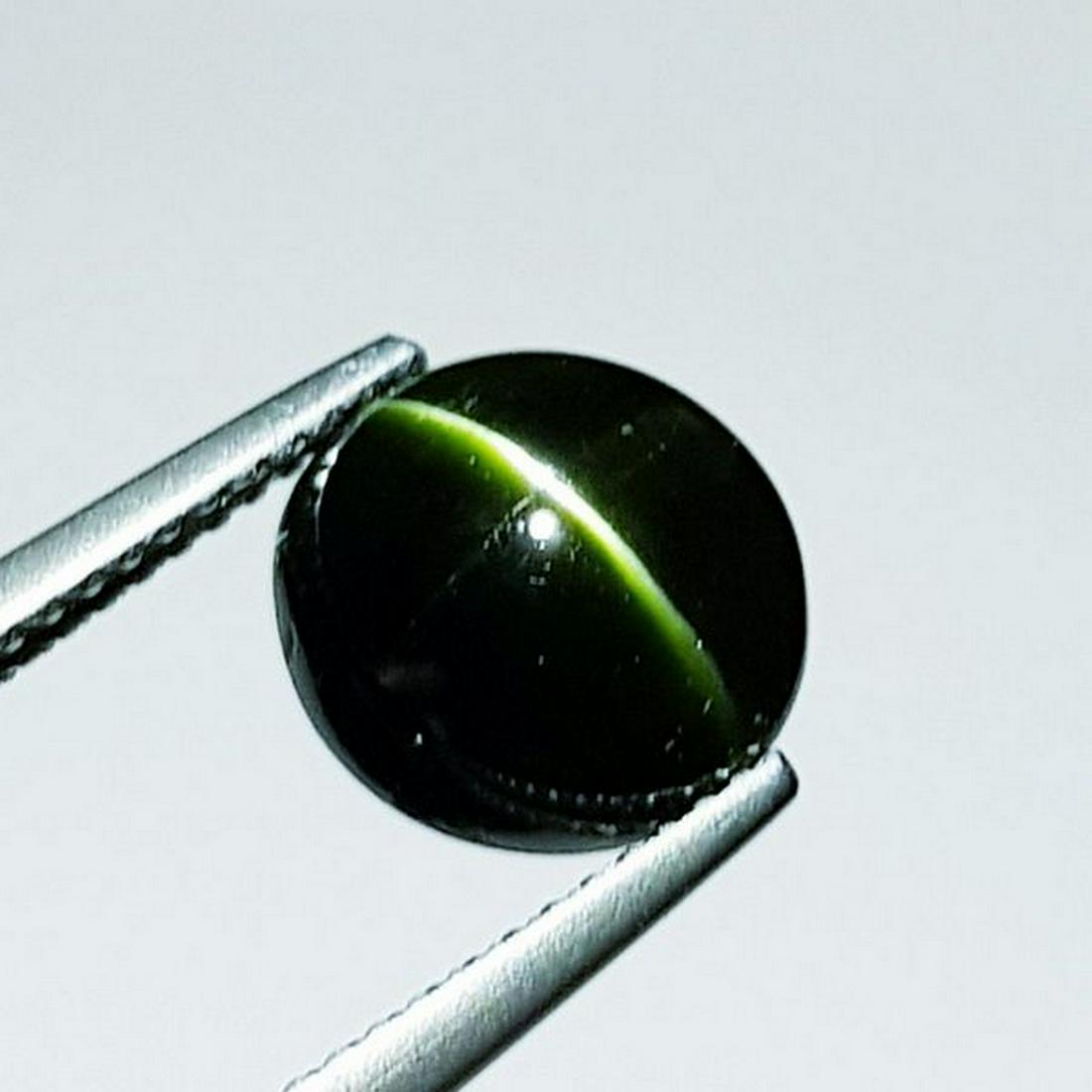 Natural kornerupine Cat's Eye 4.76 ct: No Reserve! Title: Natural kornerupine Cat's Eye 4.76 ct Color/Clarity: Opaque Gemstones: Loosegemstone Carat Weights: 4.76 Size/Dimensions: 9.50 x 9.50 x 6.50 Additional Information: Oval - Srilanka 