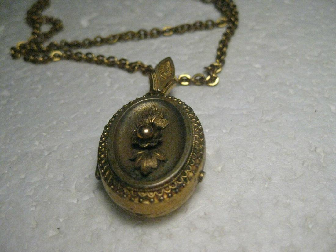 Vintage Victorian/Art Nouveau Locket, 2 Sides, 24": Vintage 1800's-early 1900's Gold Filled Locket on 24" Chain. Marked 1/20 12kt Gold Filled. This has a hinged locket, with a photo area on each side. Thin glass? window - the left side has a red like w