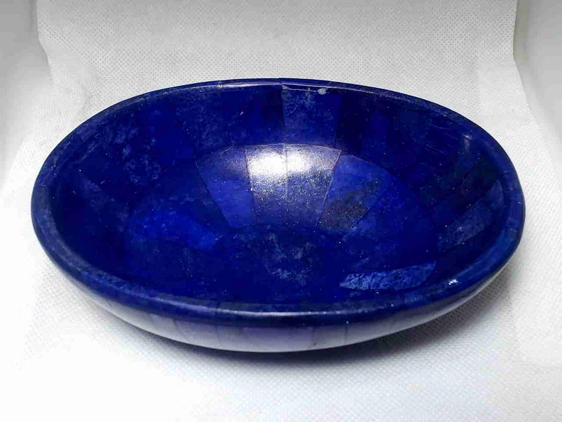 Royal Blue Lapis Lazuli Bowl: Title: Royal Blue Lapis Lazuli Bowl Gemstones: Mineral Carat Weights: 402 Grams Size/Dimensions: 15X11X4.5 CM Additional Info: Royal Blue Lapis Lazuli Bowl Reserve: $65.00 Shipping: Domestic: Flat-rat