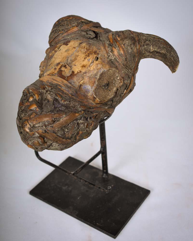 Fetish Figure – Bone, Wood – Bulu – Cameroon: Ancient fetish figure used by a Medicine Man during ritual ceremonies. The fetish is made out of wood, animal skull, rotan and clay. Good condition with traces of wear and tear. With no exact definiti