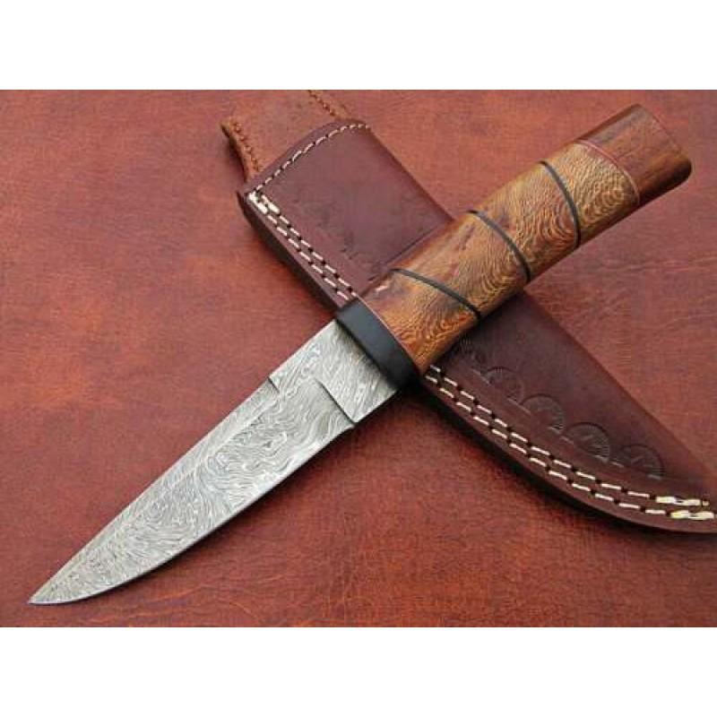 Modern pattern-welded Damascus steel knife, sheesha: Knife "Guru" made of damask steel. Handle – sheesha wood, scabbard - sheep leather sheath. Damascus knives are very durable, look great and keep sharpness perfectly. Modern pattern-welded Damascus s