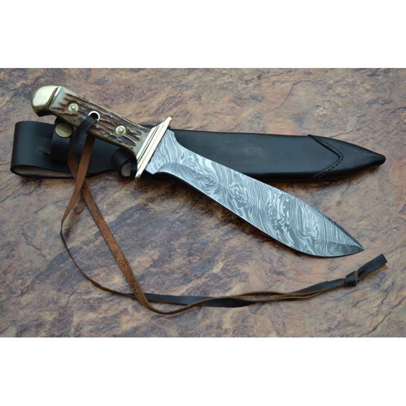 Antler Damascus steel knife,with leather sheath,brass: Knife "Artisan" made of damask steel. Handle Â– brass guard and pomel, scabbard - leather. Damascus knives are very durable, look great and keep sharpness perfectly. Damascus steel has high quality