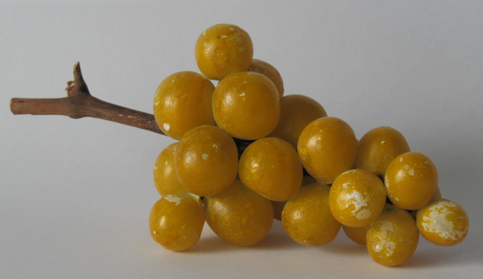 Cluster of vintage stone grapes. (1 of 1)