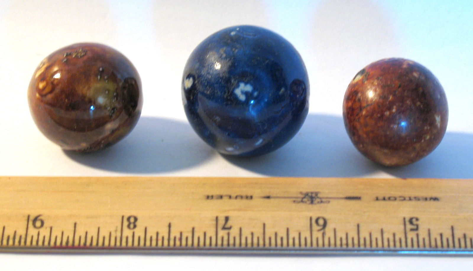 Three large size agate marbles. (1 of 2)
