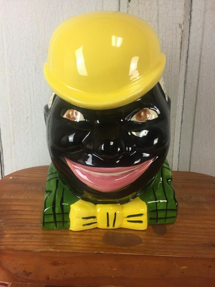 Limited Black Americana Mcmee Cookie Jar Uncle Justin: Title: Limited Black Americana Mcmee Cookie Jar Uncle Justin 171/500 Date/Period: 1993 Dimension: Approx: 10” tall x 6” wide x 6” deep Material: Ceramic Additional Information: A great example o