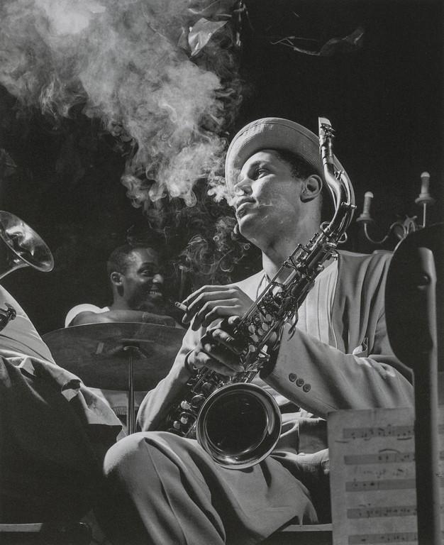 HERMAN LEONARD - Dexter Gordon, Drummer Kenny Clarke: Artist: HERMAN LEONARD Title: Dexter Gordon, Drummer Kenny Clarke, Royal Roost, NY, 1948 Medium: Photo Litho, 2006, China Dimensions: 7.4x9.1" Description: Heat Wax Mounted on 11x14" Conservation Boar
