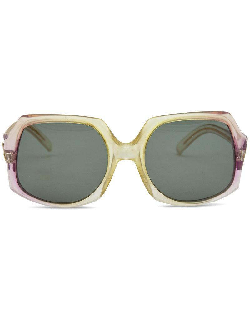 Nina Ricci Oversized Gradient Sunglasses: Classic 70s style Nina Ricci purple gradient frames with grey lenses. Signed Nina Ricci Paris on the interior of each arm and large N on both sides. Slight imperfections on the right arm. Otherwise in