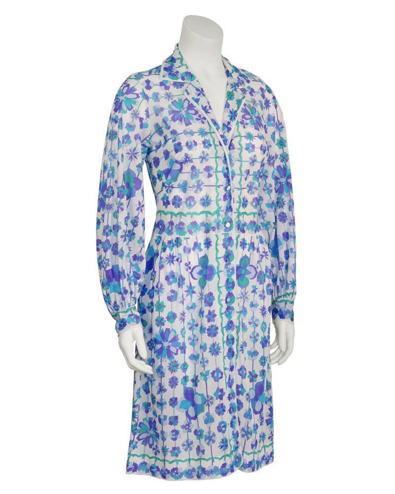 Emilio Pucci Blue and White Flower Print Cover Up: Perfect blue and green nylon floral printed cover up by Emilio Pucci for Form Fit Rogers from the 1970's. The top does up the front with simple white buttons and the all over floral pattern is carried