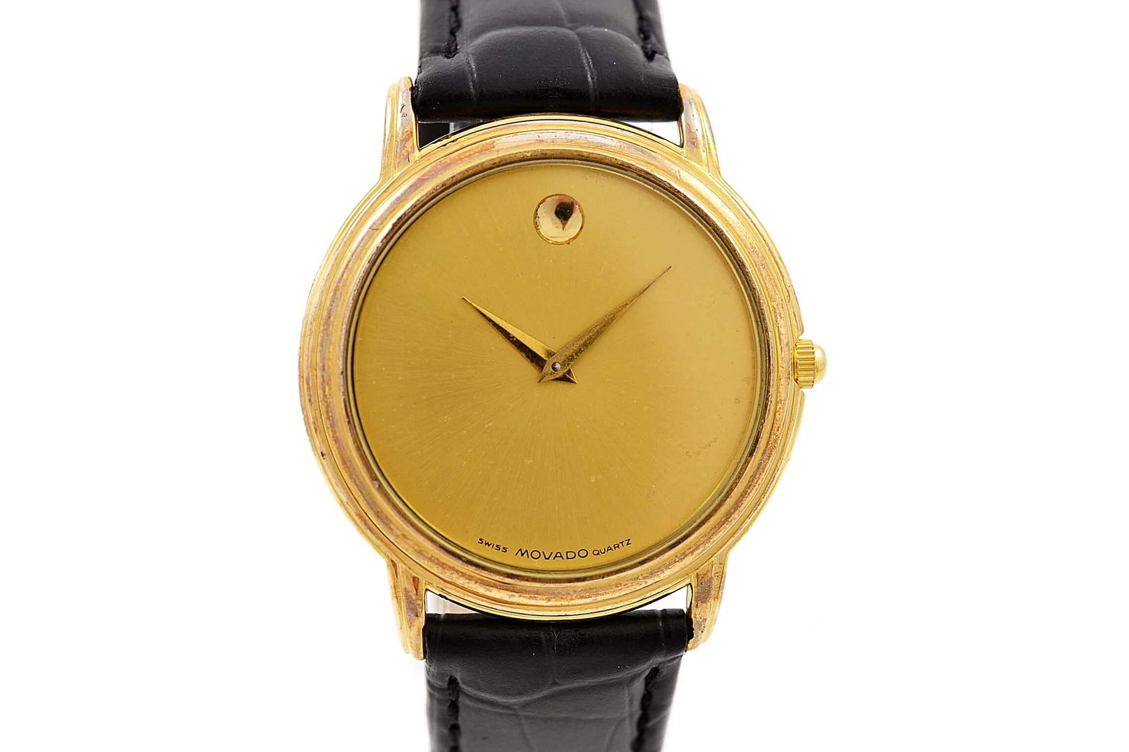 Movado Museum Gold Plated Midsize Dress Quartz Watch: Title: Movado Museum Gold Plated Midsize Dress Quartz Watch Brand: Movado Date: 1990s Model: Museum Movement: Quartz Functions: Time Case Metal: Gold Plated Case Size: 34mm X 40mm Diamonds/Gemstones:
