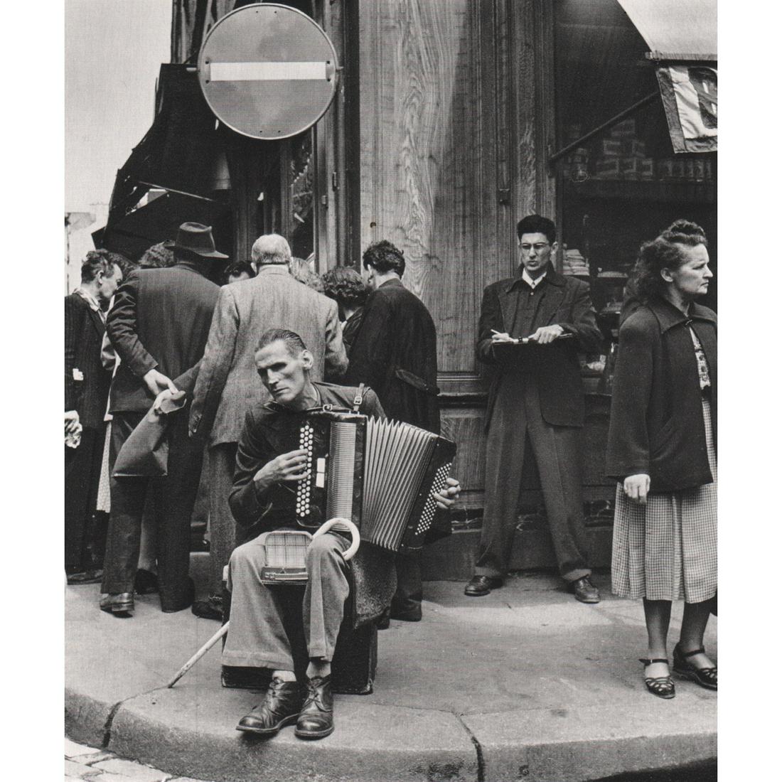 ROBERT DOISNEAU - Concertina Player in the Rue: Artist: ROBERT DOISNEAU Print Title: Concertina Player in the Rue Mouffetard, 1951 Medium: Sheet-fed Gravure Printing Date: 1970's Printed in France Image Size: 8 x 7 inches Robert Doisneau (1912-1994