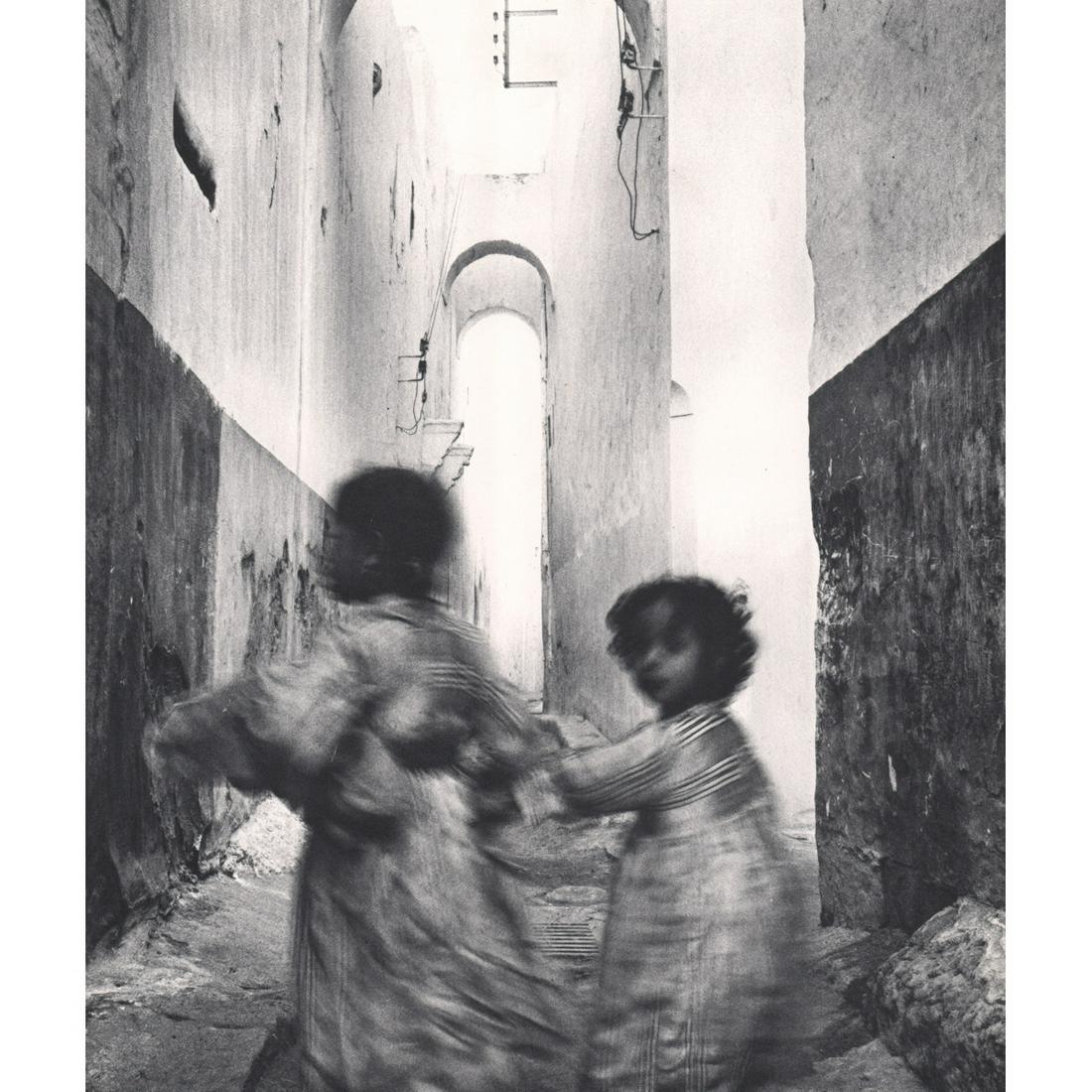 IRVING PENN - Two Elegant Children: Artist: IRVING PENN Print Title: Two Elegant Children in the white city of Rabat Medium: Sheet-fed Gravure Printing Date: 1960's Printed in Switzerland Image Size approx: 10 X 8.5 inches Irving Pennwa