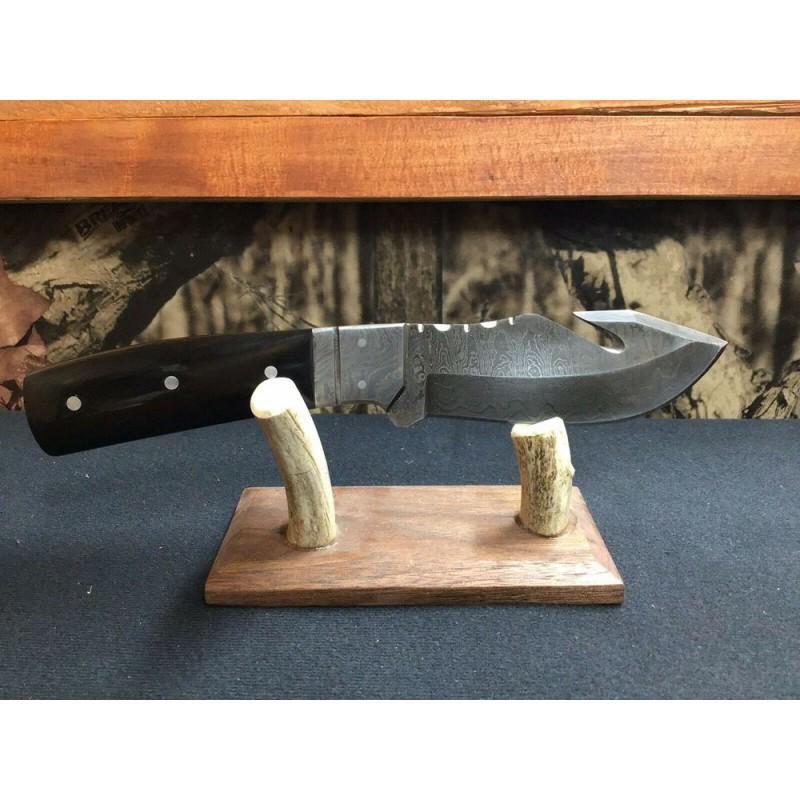 Damascus steel knife, leather sheath, buffalo horn: Knife "Faith" made of damask steel. Handle Â– buffalo horn & steel pins, scabbard - leather. Damascus knives are very durable, look great and keep sharpness perfectly. Damascus steel has high quali