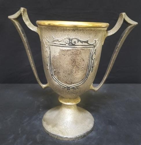 Vintage Sterling on Bronze Trophy: Vintage Sterling on Bronze "Silvercrest" Trophy.Beautiful and decorative vintage trophy. Stamped and numbered on the bottom.Letters are faded due to it's age.Needs cleaning and polishing.Approximate s