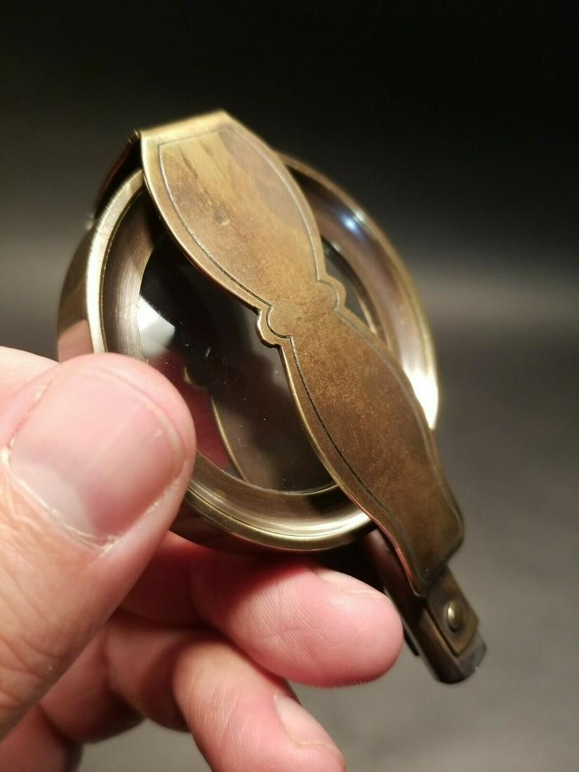 Brass Pocket Folding Optical Glass Magnifying Lens: Nice reproduction of an antique brass flip out Magnification glass or lens. Magnifying glasses like this were used in the 18th and 19th century due to the poor lighting and eyesight. This piece is mad