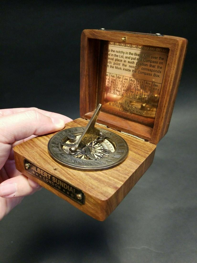 Wood Brass Sundial Compass: 3 1/2" x 3 1/2" x 1 3/4" Such a neat antique reproduction sundial compass! This piece is all wood with a brass compass. As you can see the hardwood box has a nice compass rose inlay with aged brass pl