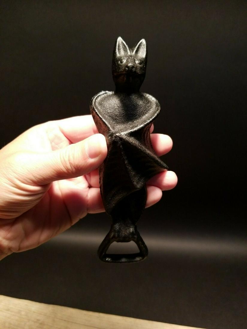 Cast Iron Bat Beer Bottle Opener: 6 3/4" Long 2 1/4" wide Wonderful reproduction white cast iron bat bottle opener. New made to look just like the original all cast iron with slightly distressed paint. Such a neat heavy duty collectib