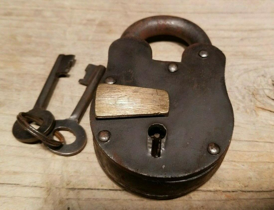 Cast Iron Padlock Lock & Key: 4 1/2" tall x 2 5/8" Wide Nice reproduction cast iron padlock! This lock is fully functional! Hard to tell its age. Heavy iron and brass. Great aged patina throughout. Limited quantity available! Rese