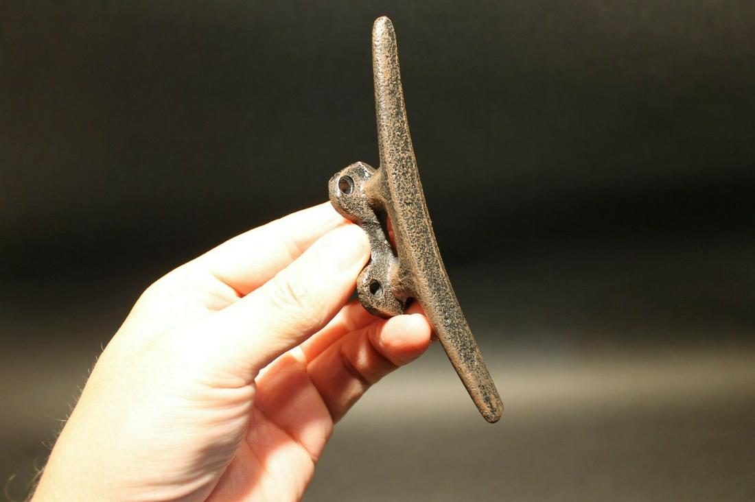 Cast Iron Coastal Nautical Hook Coat Hanger: 5" Tall x 1 1/8" Wide x 1 1/8" Extension Such a neat reproduction cast iron wall hook. As you can see this cast iron hook is perfect for any coastal or nautical setting. The finish is a very sturdy re