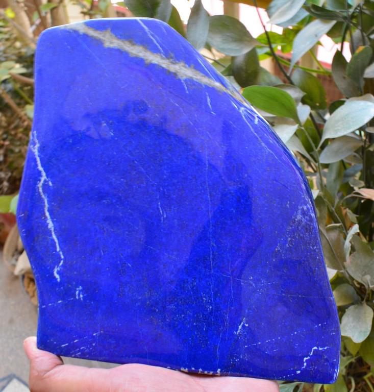 1800 Grams Natural Lapis Lazuli Tumble: Title: 1800 Grams Natural Lapis Lazuli Tumble Origin: Afghanistan Weight: 1800 Grams Size/Dimensions: 228x190x16 MM Description: Natural Reserve: $200.00 Shipping: Domestic: Flat-rate of $40.00 to any