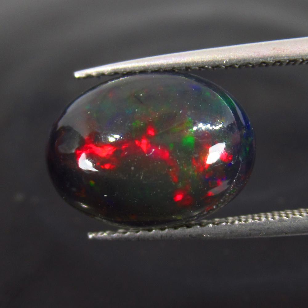 3.64 Ct Natural Ethiopian Black Fire Opal Oval Cab: No Reserve! Title: 3.64 Ct Natural Ethiopian Black Fire Opal Oval Cab Stone Clarity: Translucent Gemstone: Natural Black Opal Carat Weight: 3.64 Size/Dimensions: 13.60 x 10.40 x 5.50 mm Additional Inf