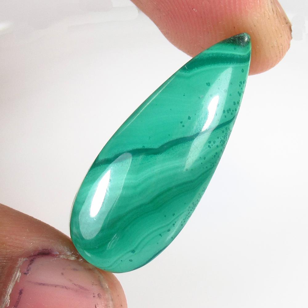 27.25 Ct Natural Drilled Green Malachite Pear Cab: No Reserve! Title: 27.25 Ct Natural Drilled Green Malachite Pear Cab Stone Clarity: Opaque Gemstone: Natural Malachite Carat Weight: 27.25 Size/Dimensions: 24.00 x 11.50 x 7.20 mm Additional Informati