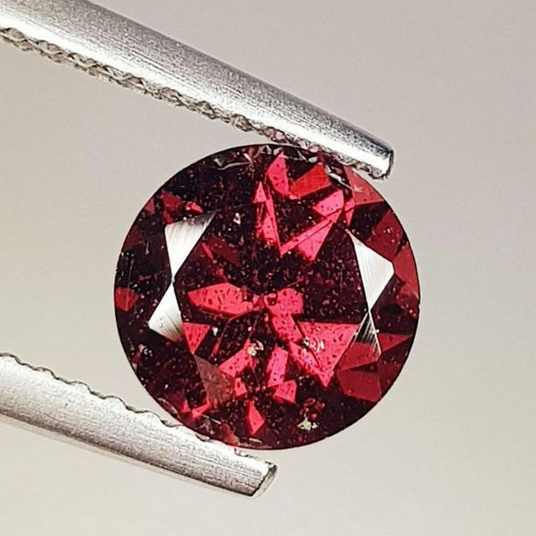 Natural Rhodolite Garnet Round Cut 1.80 ct: No Reserve! Title: Natural Rhodolite Garnet Round Cut 1.80 ct Color/Clarity: VVS - VS Carat Weight: 1.8 Size/Dimensions: 7.00 x 7.00 x 4.70 Additional Information: Round - Burma Shipping: Domestic: F