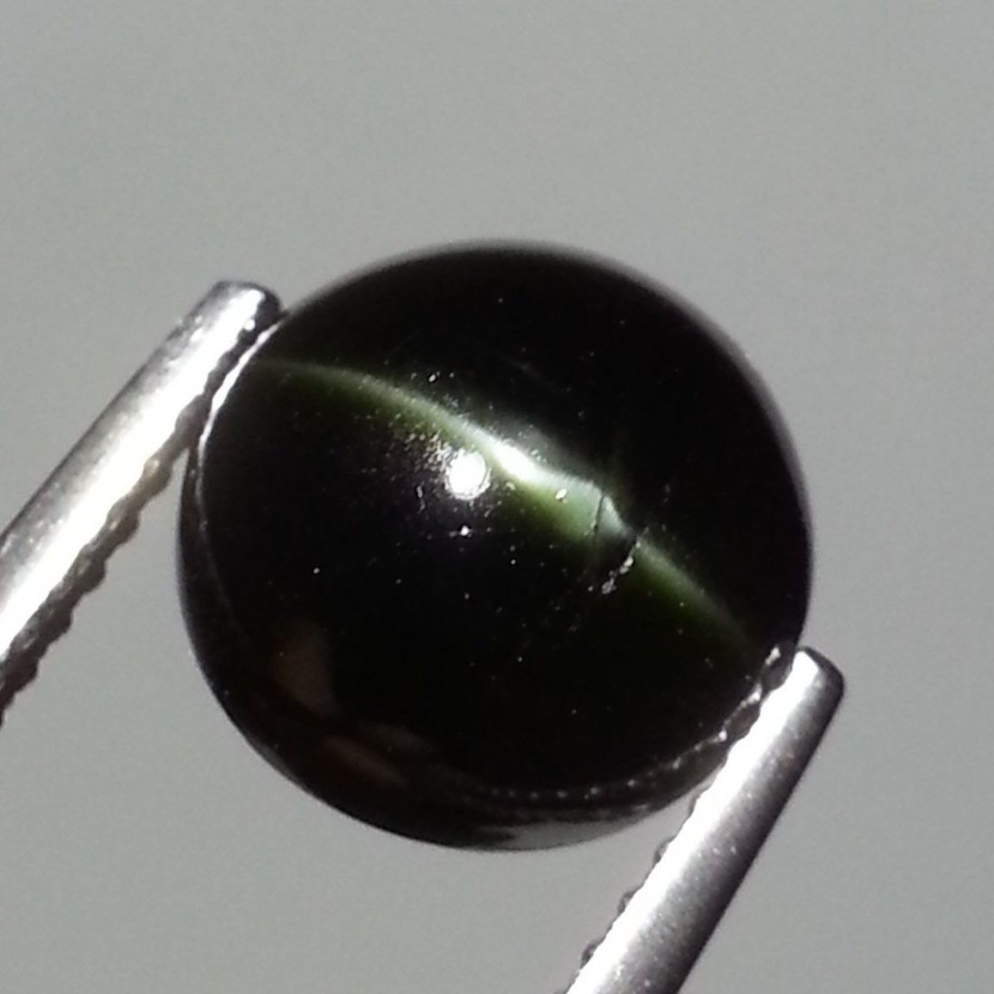 Natural Kornerupine Cat: No Reserve! Title: Natural Kornerupine Cat's Eye 3.99 ct Color/Clarity: Opaque Carat Weight: 3.99 Size/Dimensions: 9.20 x 9.20 x 5.30 Additional Information: Round - Srilanka Shipping: Domestic: Flat