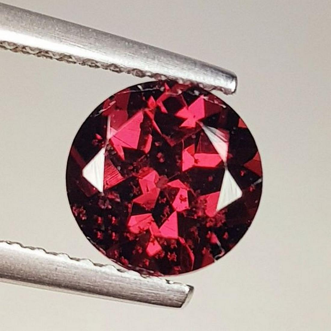 Natural Rhodolite Garnet Round Cut 1.87 ct: No Reserve! Title: Natural Rhodolite Garnet Round Cut 1.87 ct Color/Clarity: VVS - VS Carat Weight: 1.87 Size/Dimensions: 7.00 x 7.00 x 4.60 Additional Information: Round - Burma Shipping: Domestic: