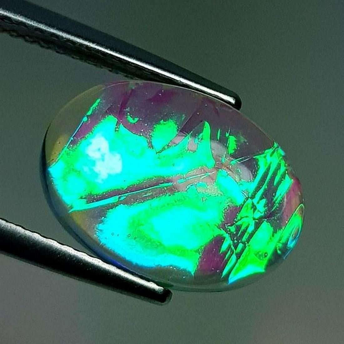 Australian Doublet Opal 5.95 ct: No Reserve! Title: Australian Doublet Opal 5.95 ct Color/Clarity: Semi Transparent Carat Weight: 5.95 Size/Dimensions: 14.10 x 10.20 x 5.30 Additional Information: Oval - Australia Shipping: Domestic