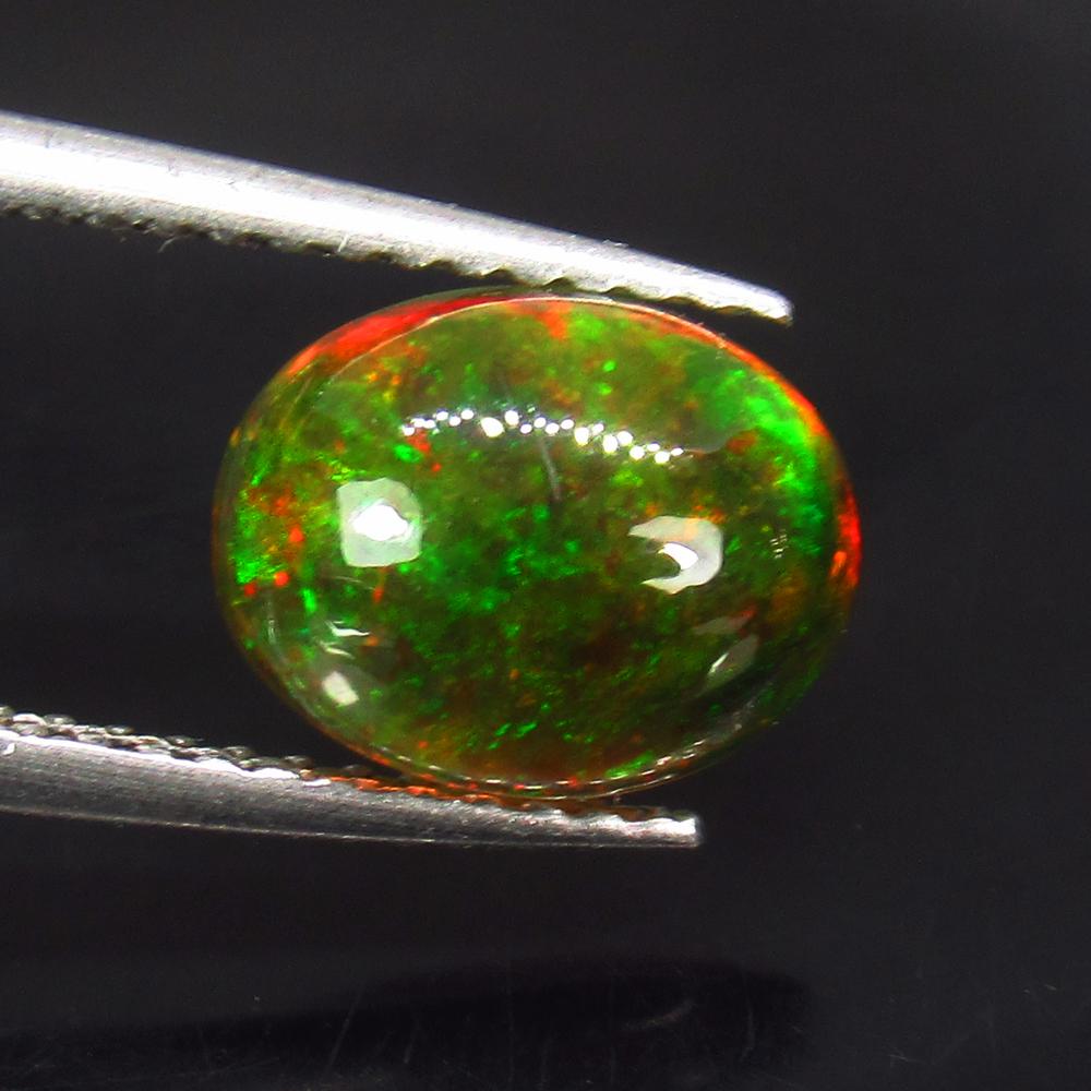 1.55 Ctw Natural Ethiopian Black Fire Opal Oval Cab: No Reserve! Title: 1.55 Ctw Natural Ethiopian Black Fire Opal Oval Cab Stone Clarity: Transparent Gemstones: Black Opal Carat Weights: 1.55 Size/Dimensions: 9.20 x 7.20 x 4.40 mm Additional Informatio