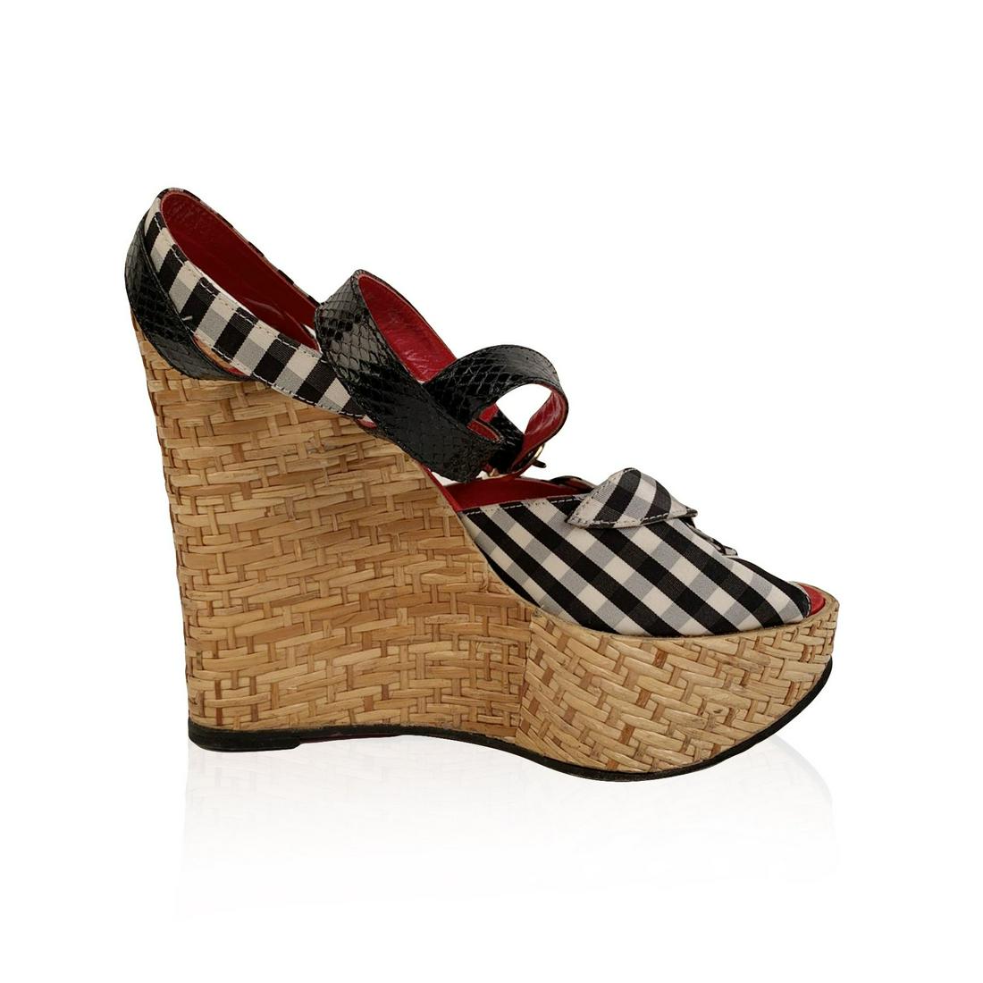 Dolce & Gabbana Checkered Open Toes Wedge Sandals Size: Dolce & Gabbana's wedges sandals with black and white checkered upper. Wicker wedges. Open toe. Buckle-fastening ankle strap. Size: 38. Heels height: 5.5 inches - 14 cm Details MATERIAL: Fabric COLOR: