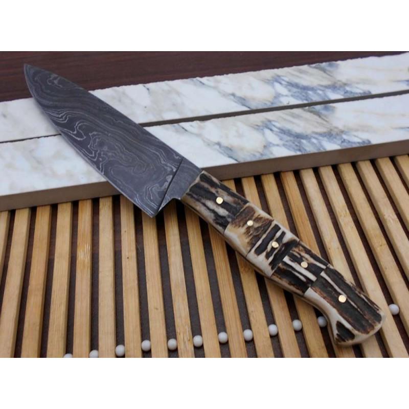 Damascus steel knife, with stag antler handle, chef: Knife "Slug" made of damask steel. Handle – stag antler, without scabbard . Damascus knives are very durable, look great and keep sharpness perfectly. Damascus steel has high quality contents to giv