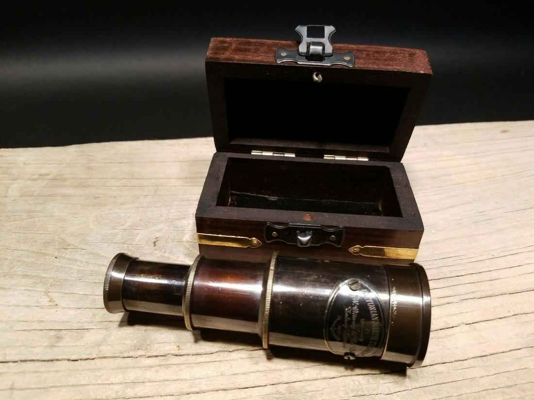 Victorian Marine Wood Box w Telescope: Box measures 3 3/4" Long x 2 1/8 wide x 2" tall Telescope measures 2 1/2" Long closed x 4 1/2" open Nice quality reproduction of a traveling pocket telescope and cap. This piece is all brass with a ha