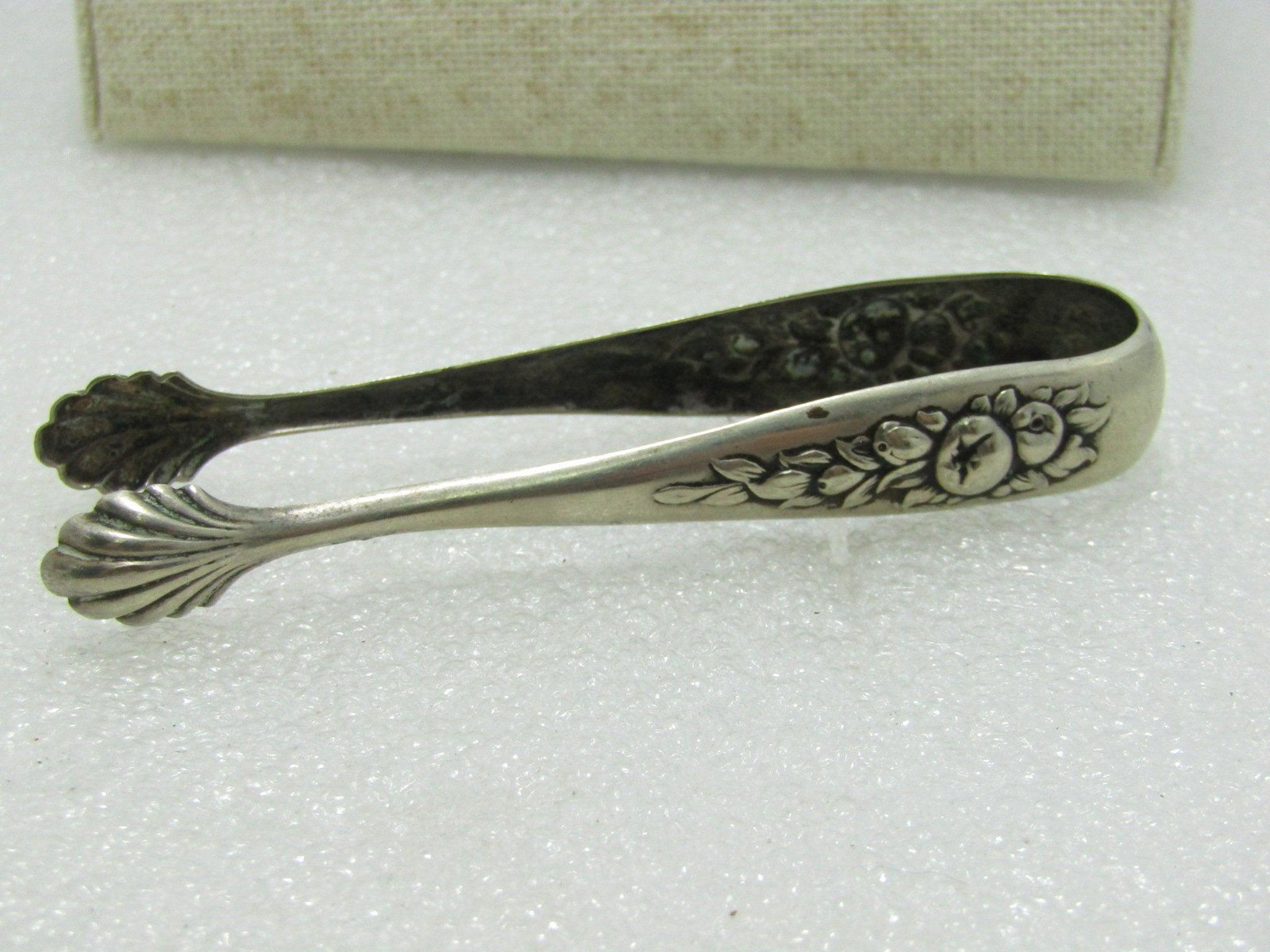 Vintage Silverplate Leaf & Fruit Sugar Tongs - 3.5": Vintage Silverplate Leaves & Fruit Sugar Tongs - 3.5" long and 5/8" wide at the top and tapers down to about 1/2" at the fanned/shell tips. Age is appx. 1930's to 1950's. They do not test as sterling.