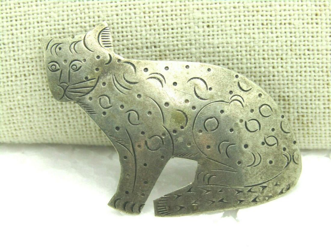 Vintage Scrolled Cat Brooch, Silver Tone, 2" by 1.5",: Vintage Scrolled Cat rooch, country, folk art look - it is a slightly round and shape cat with cute details. Silver tone metal. 2" long and 1.5" tall. Some light wear and could use polishing. The pinb