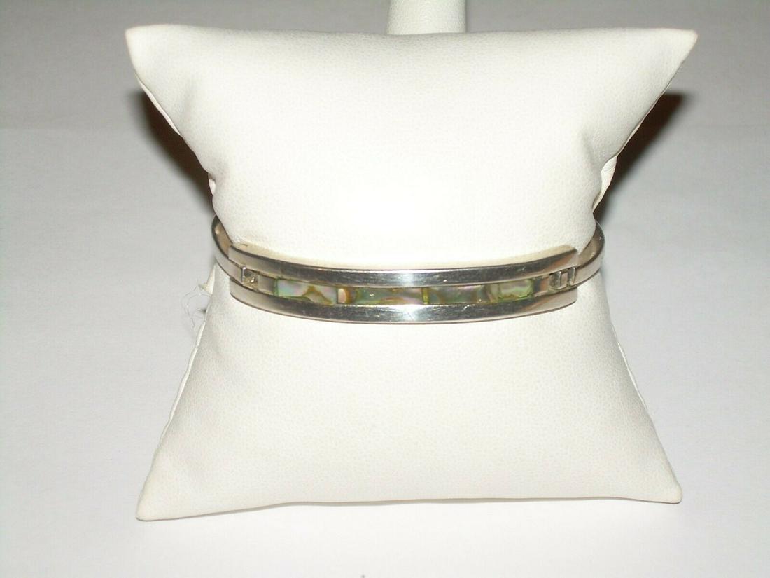 Mexican Inlaid Abalone Cuff Bracelet - Alpaca Silver;: Vintage Mexican Alpaca silver inlaid bracelet. (Alpaca is a Mexican alloy made to look like sterling but it is not silver.) The inlay is Abalone. The bracelet measures 2.5" wide and 2" from the front