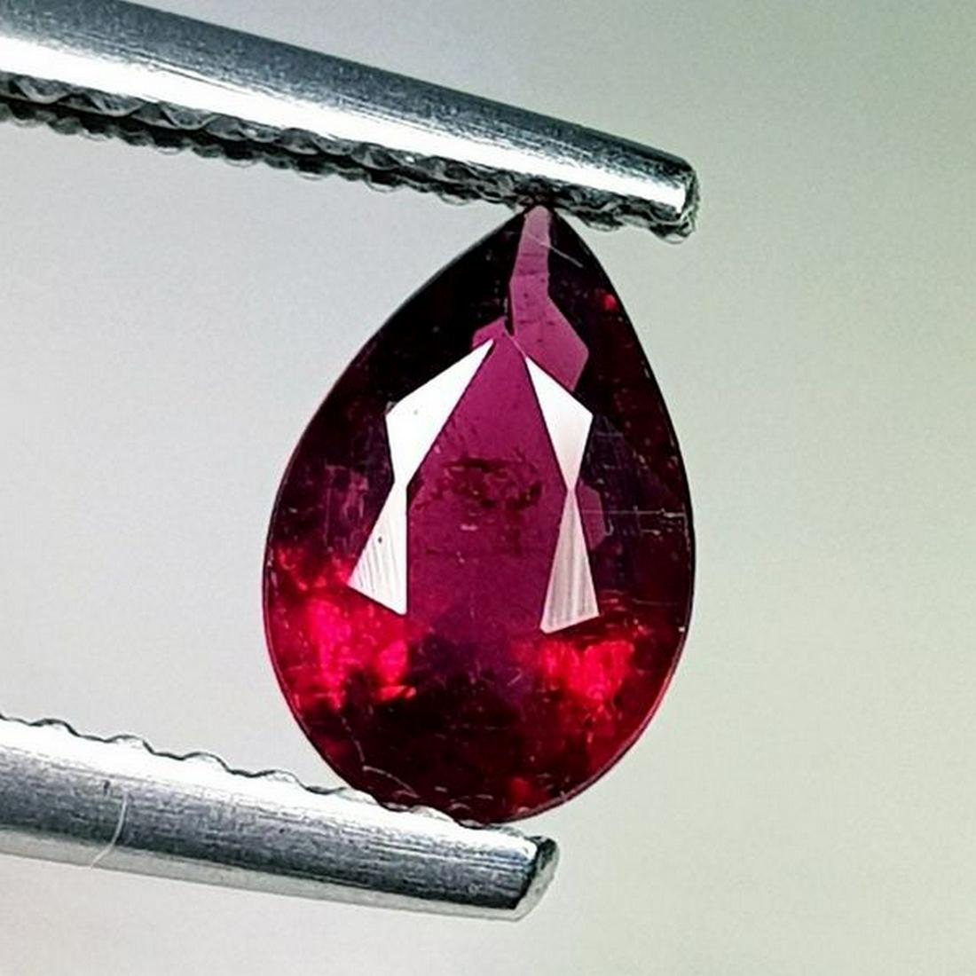 0.63 ct Natural Rubelite Tourmaline Pear Cut: No Reserve! Title: 0.63 ct Natural Rubelite Tourmaline Pear Cut Color/Clarity: SI Gemstones: Loosegemstone Carat Weights: 0.63 Size/Dimensions: 7.10 x 5.00 x 3.10 Additional Information: Oval- Brazil