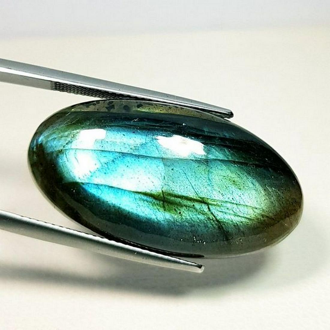 38.30 ct Natural Labradorite: No Reserve! Title: 38.30 ct Natural Labradorite Color/Clarity: Opaque Gemstones: Gemstones Carat Weights: 38.3 Size/Dimensions: 32.45 x 17.00 x 8.15 Additional Information: Oval - USA Shipping: Domes