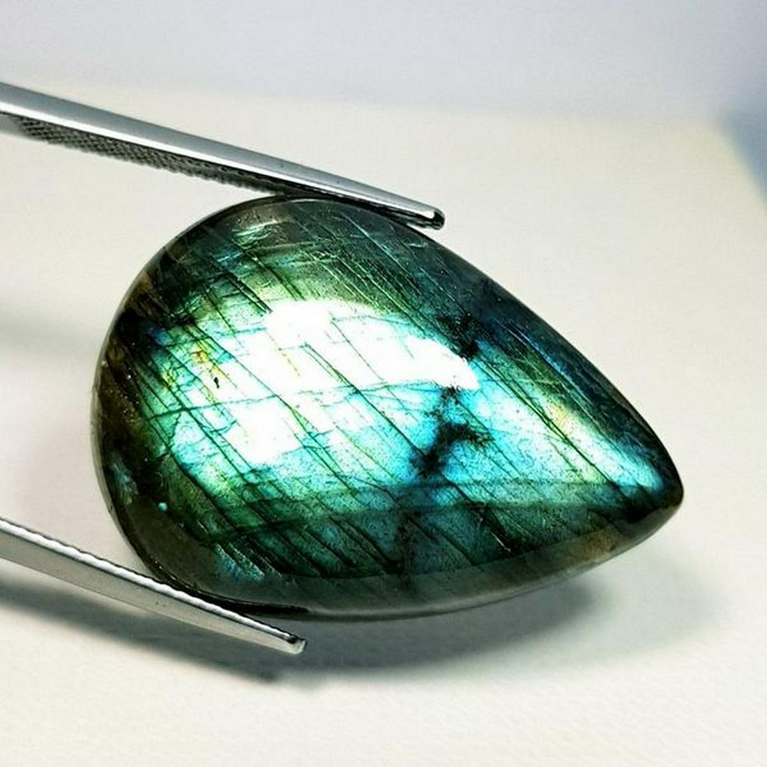 30.89 ct Natural Labradorite: No Reserve! Title: 30.89 ct Natural Labradorite Color/Clarity: Opaque Gemstones: Gemstones Carat Weights: 30.99 Size/Dimensions: 28.60 x 20.50 x 7.15 Additional Information: Pear - USA Shipping: Dome