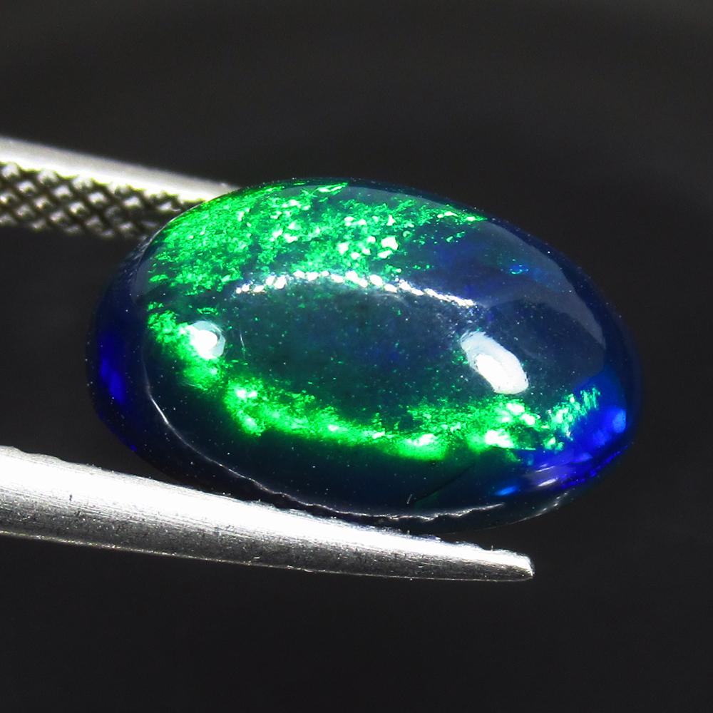 3.20 Ct Natural Ethiopian Black Fire Opal Oval Cab: No Reserve! Title: 3.20 Ct Natural Ethiopian Black Fire Opal Oval Cab Color/Clarity: Translucent Gemstone: Natural Black Opal Carat Weight: 3.20 Size/Dimensions: 13.00 x 8.60 x 6.00 mm Additional Info