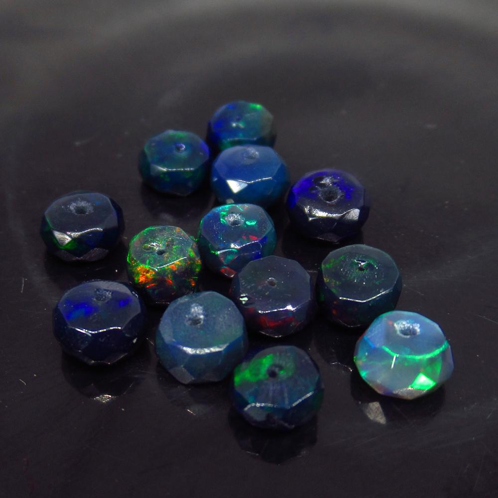4.66 Ct Natural 13 Drilled Faceted Black Fire Opal: No Reserve! Title: 4.66 Ct Natural 13 Drilled Faceted Black Fire Opal Beads Color/Clarity: Translucent Gemstone: Natural Faceted Black Opal Beads Carat Weight: 4.66 Size/Dimensions: 4.60 to 4.90 mm / 